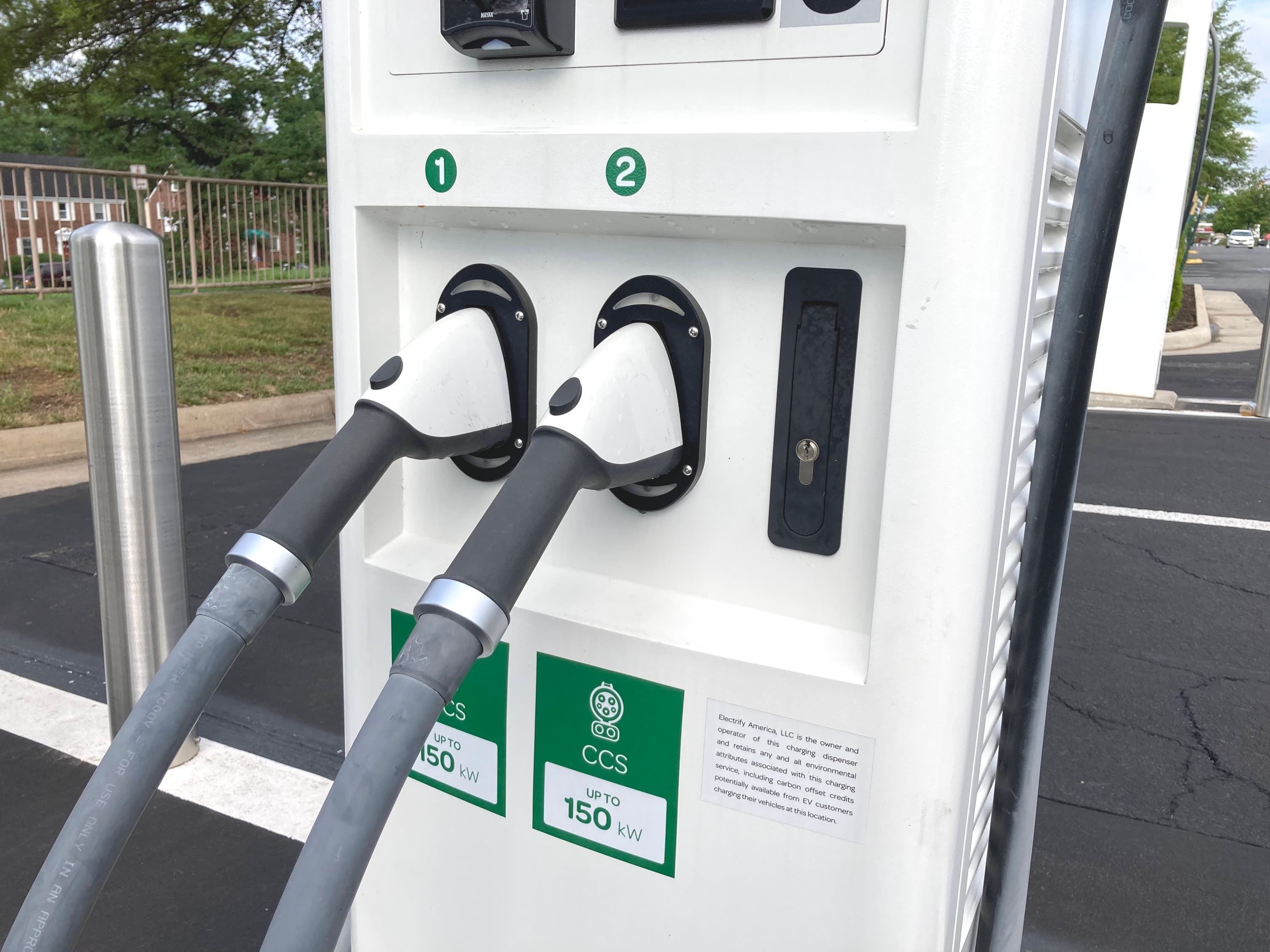 Close-up of CCS charging plugs at an EA station