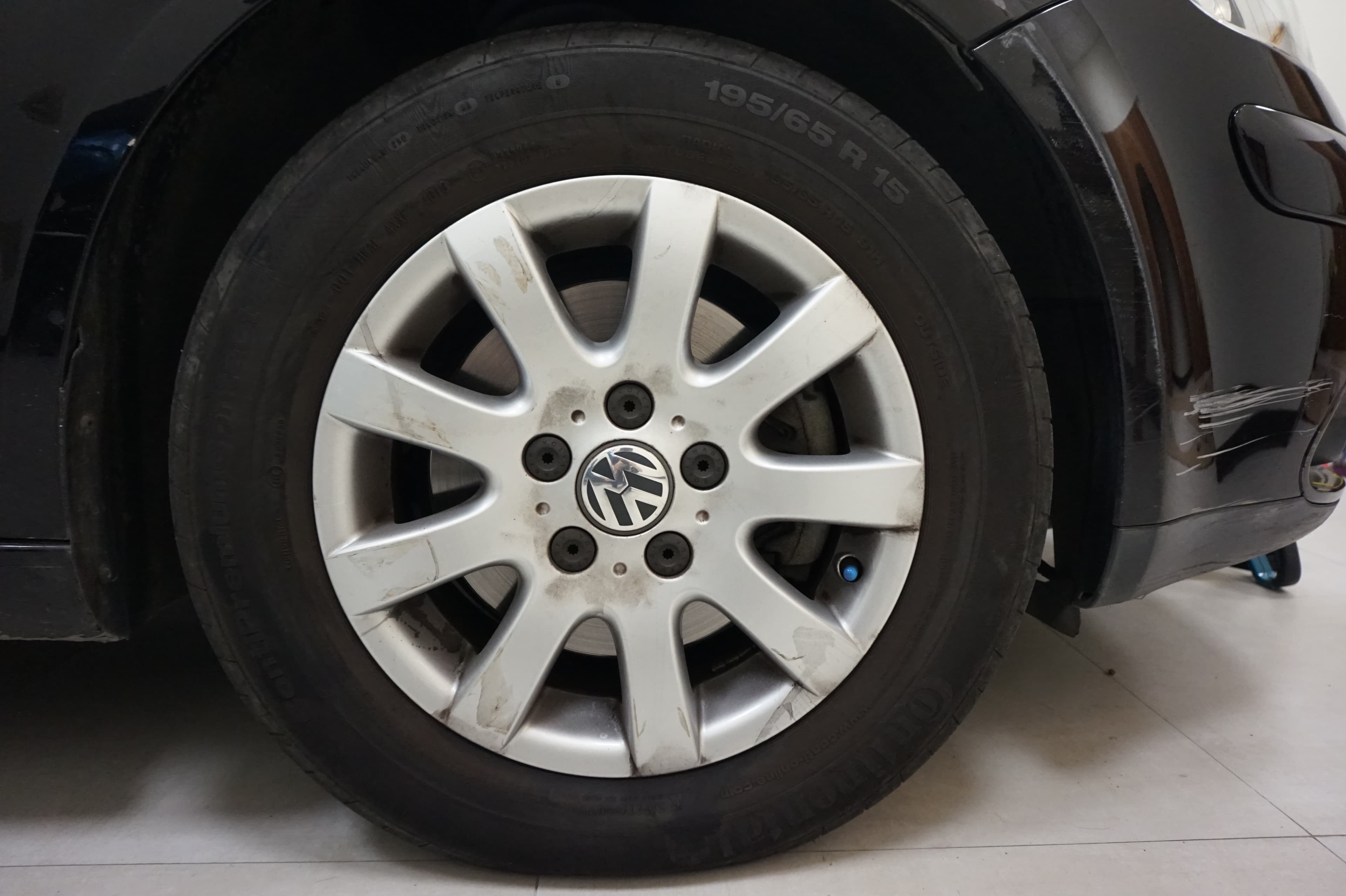 Close-up of a front tire mounted on a car
