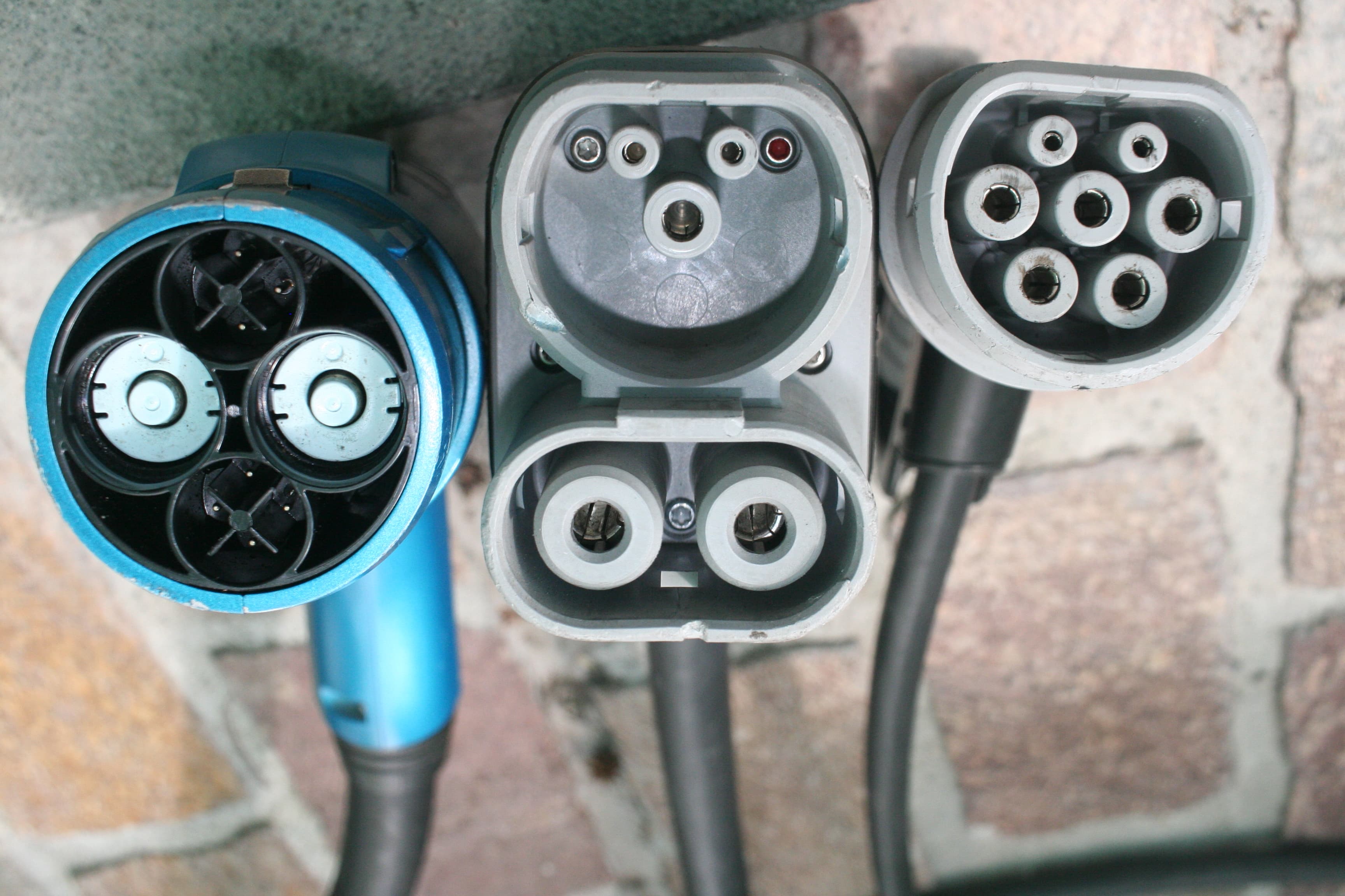 Side-by-side photo of CHAdeMO, CCS Combo 2, and Type 2 connectors