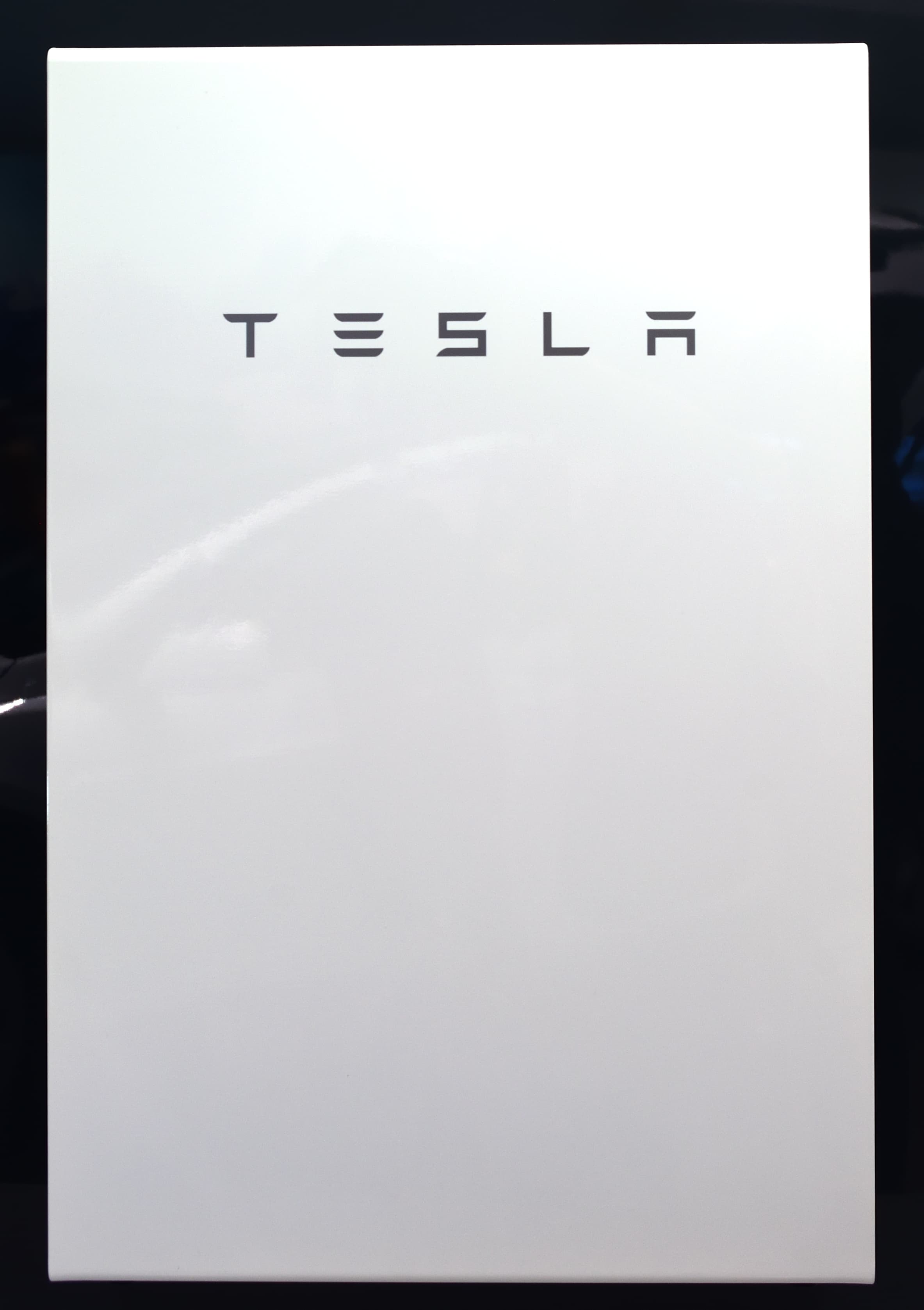 Two Tesla Powerwall units mounted on a wall.
